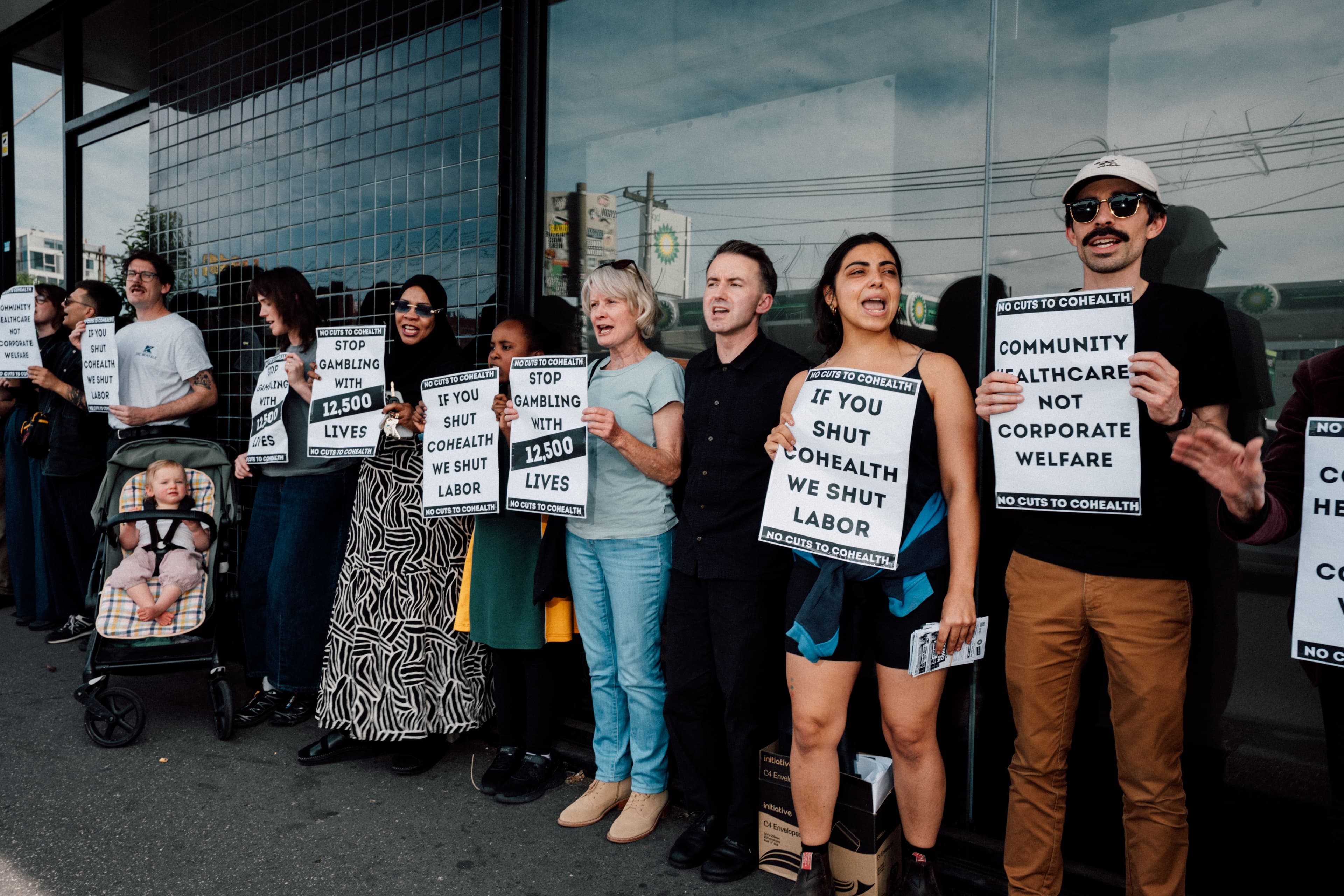 A picket line with activists holding signs