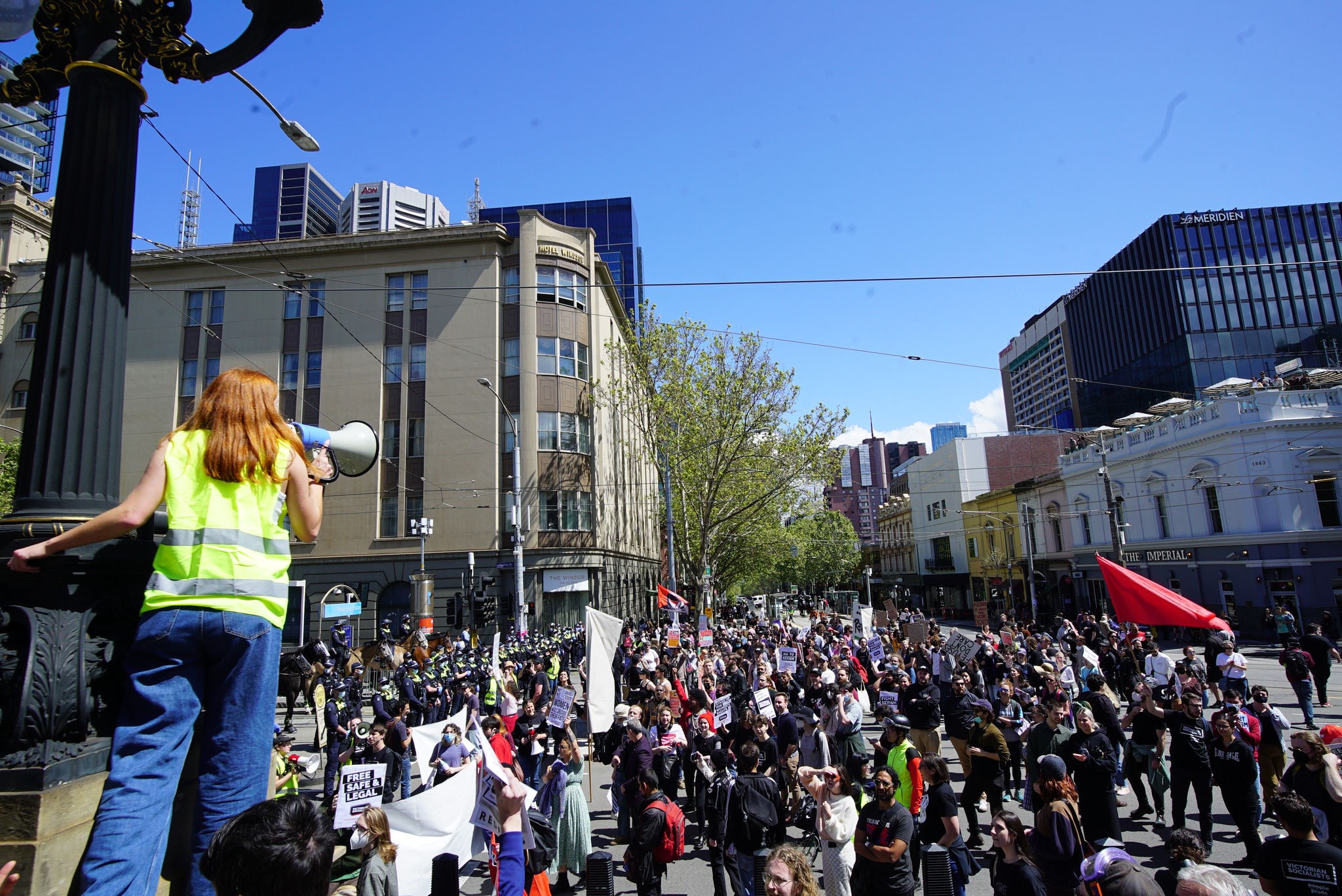 The crowd occupies the space outside parliament house